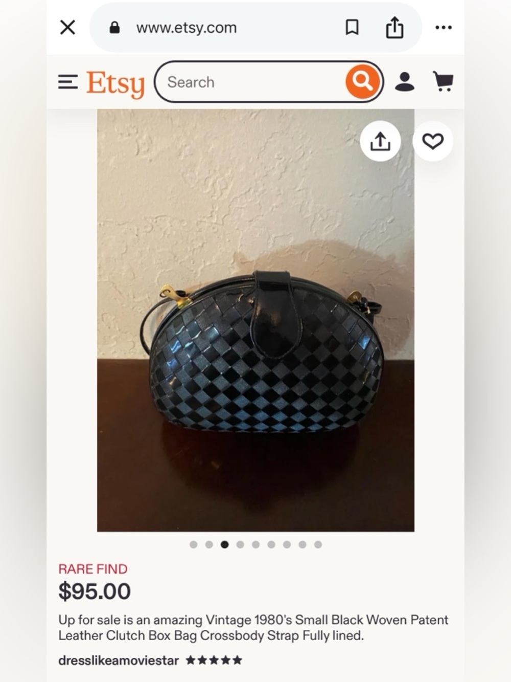 Vintage clutch bag with a crossbody strap.